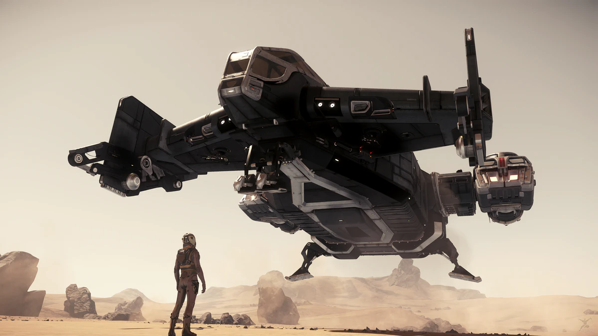 Drake Cutlass Black touching down beside a pilot on a dusty landing ground